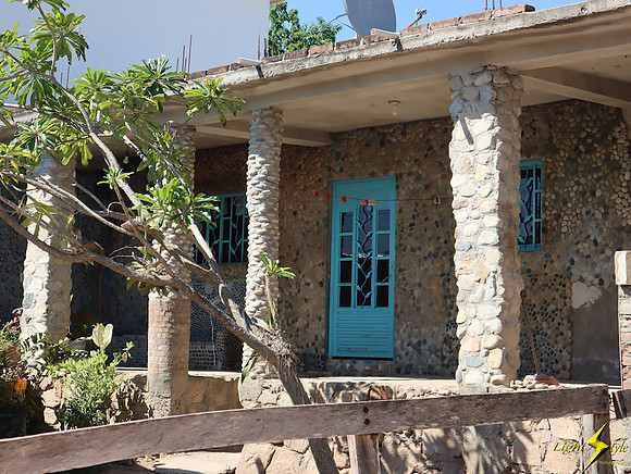 Rock house w blue door